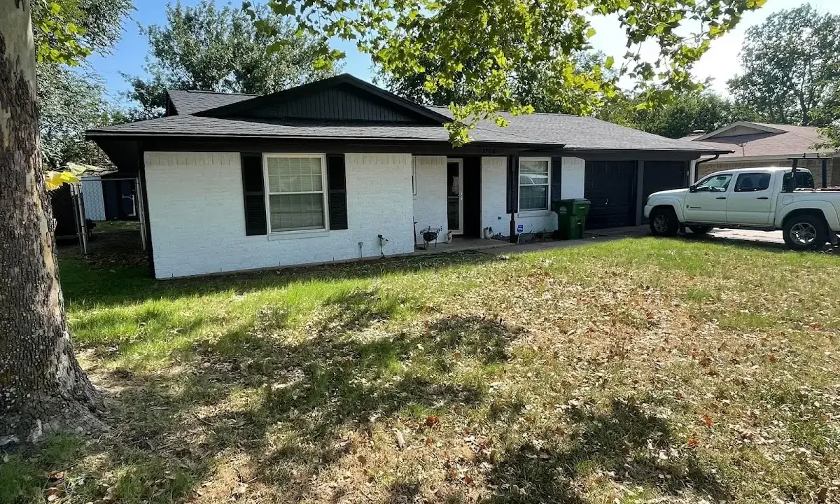 Professional roofing crew working on a residential roof in Fredericksburg